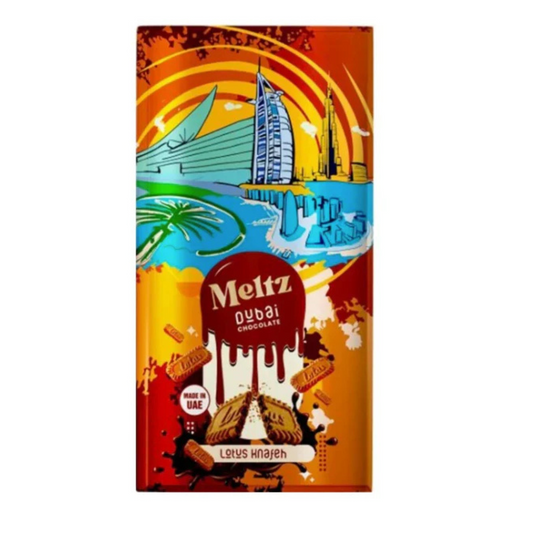MELTZ - Dubai Chocolate Lotus 192g - Sachet coloré aux motifs tropicaux avec logo MELTZ, contenant du chocolat de Dubaï aux saveurs Lotus délicieuses et croquantes